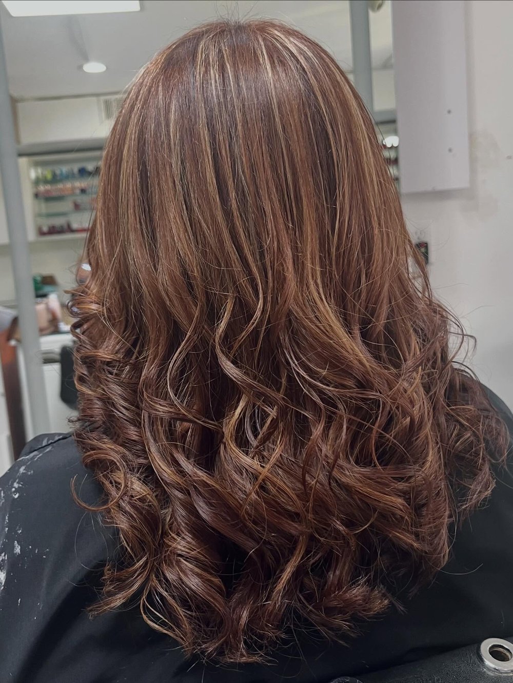 Lush Atelier client styled hair and finished look