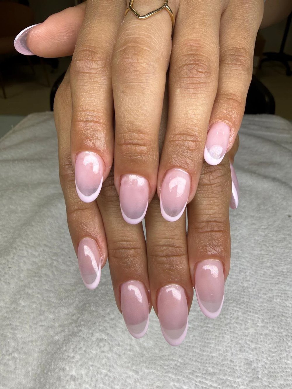 Almond nails with a soft pink base and white French tips