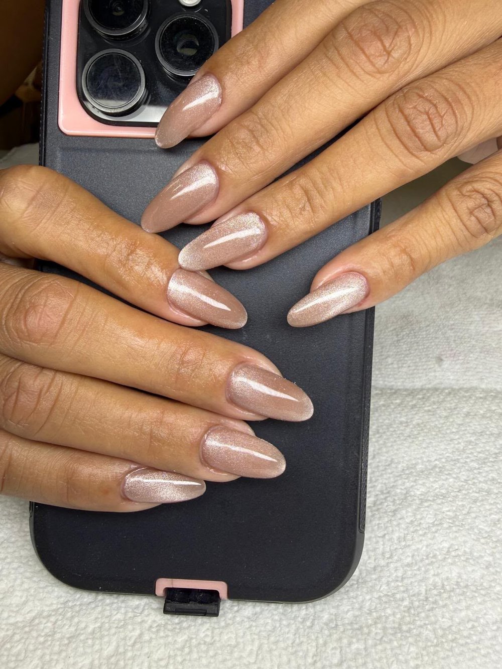 Long almond nails in shimmering nude pink with fine glitter