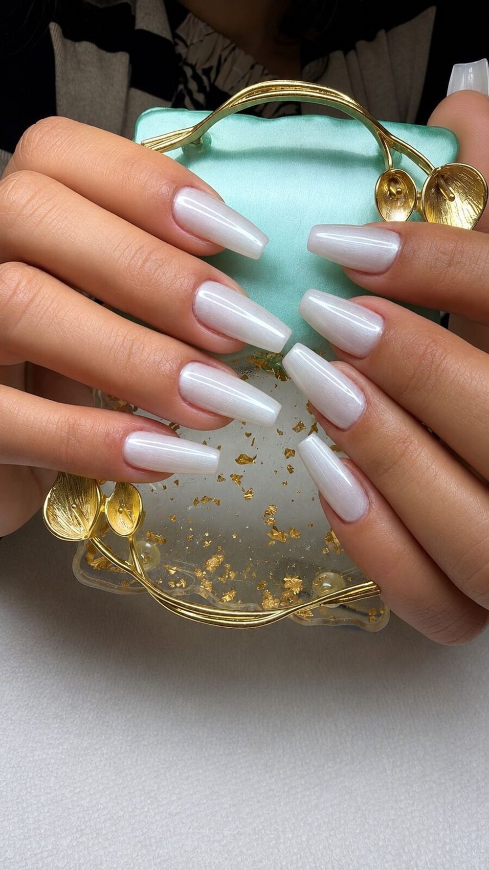 Long coffin nails in a pearly white chrome finish
