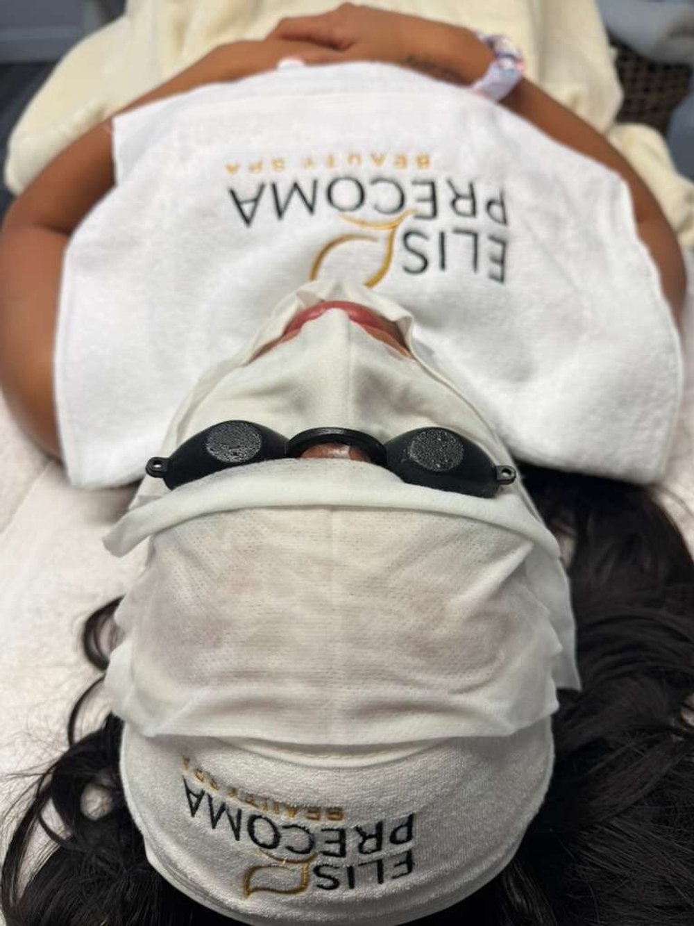 Client during an LED light facial treatment